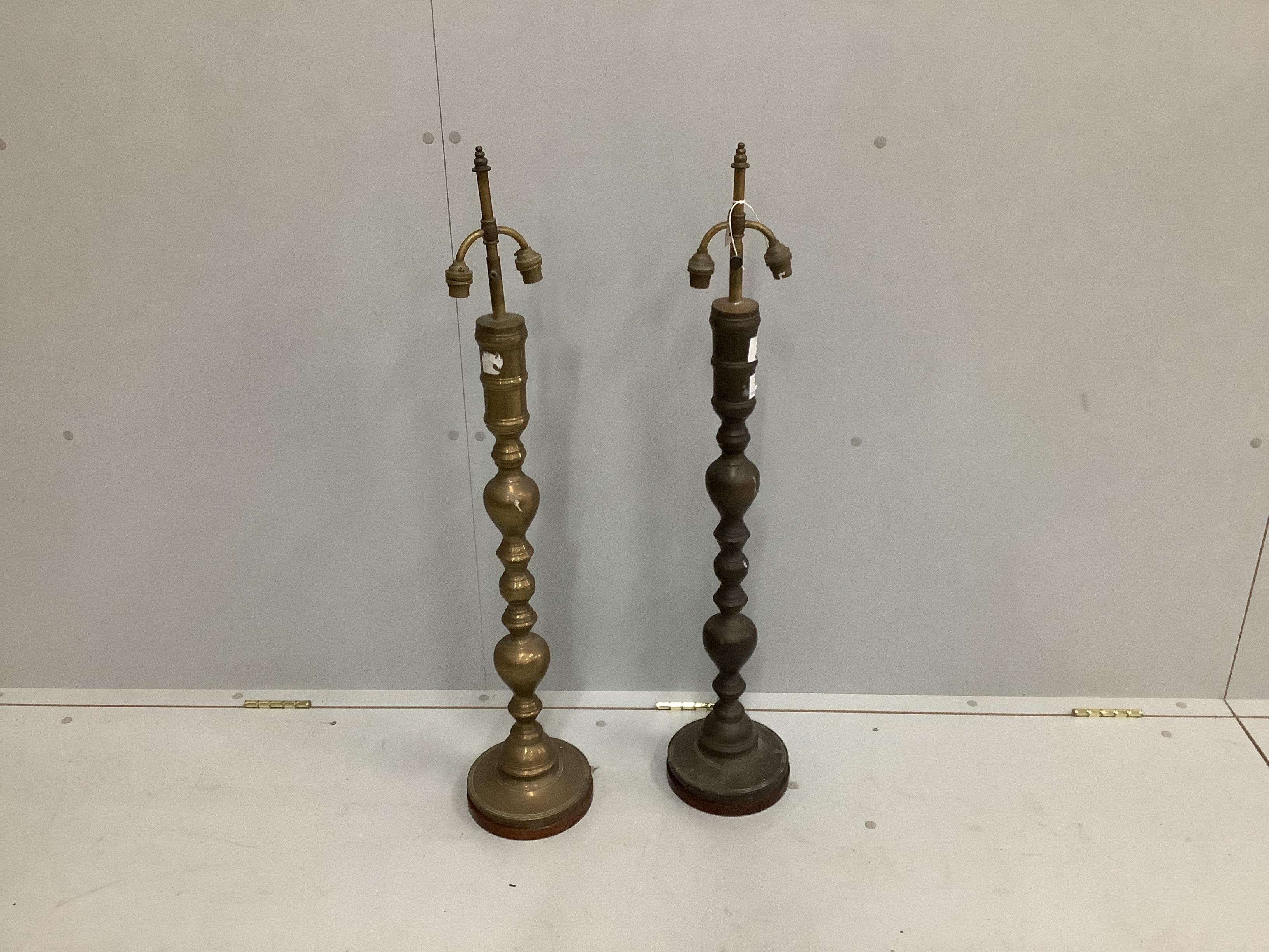 A pair of brass lamp bases, height 94cm